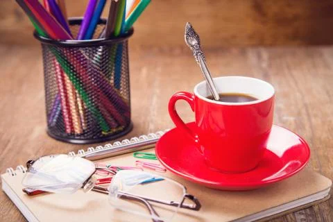 Cup with notebook Stock Photos
