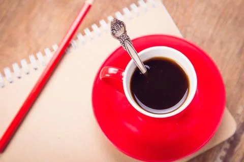 Cup with notebook Stock Photos