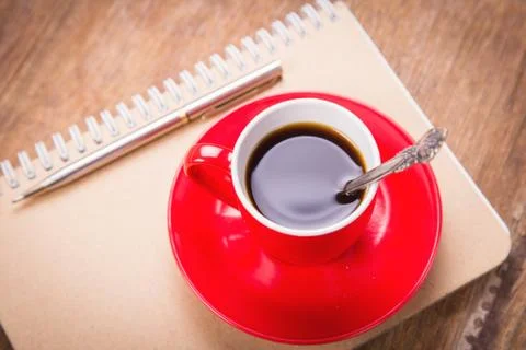 Cup with notebook Foto stock