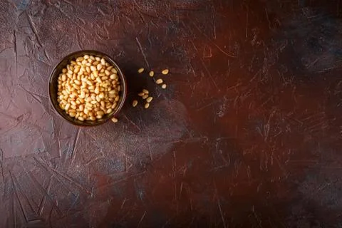 Cup with pine nuts Stock Photos