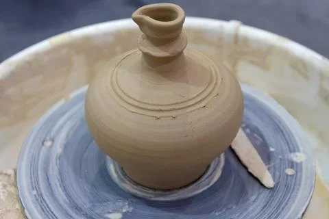 A cup on a pottery wheel in the workshop Stock Photos