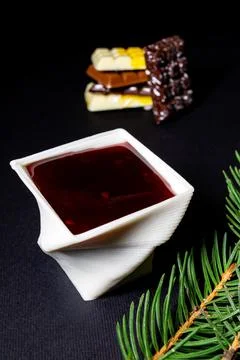 A cup printed with chocolate on a 3D printer with berry jam Foto stock