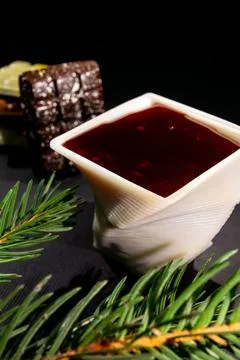 A cup printed with chocolate on a 3D printer with berry jam Stock Photos