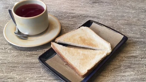Cup of red tea with bread 库存影片 332586355