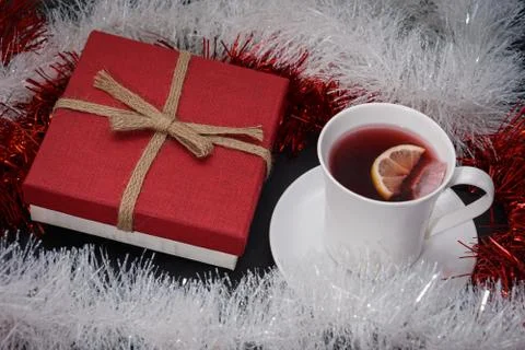 Cup of red tea with lemon slice, present on dark table Stock Photos