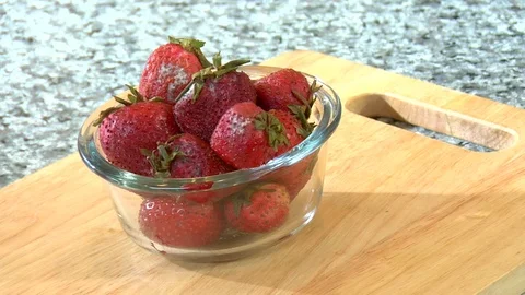 Cup of rotten and expired strawberries Stock Footage 123732410