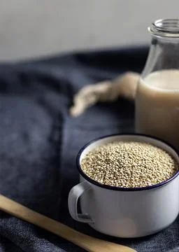 Cup with sesame placed on table Stock Photos