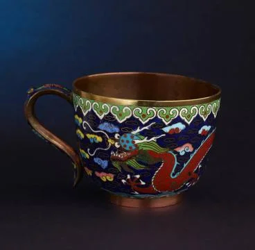 Cup with a snake pattern on a dark blue background unknown Copyright: xpie... Stock Photos