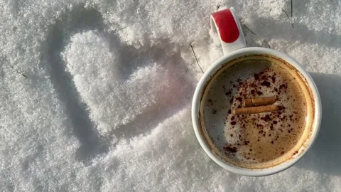 Cup on snow Stock Footage 147927435