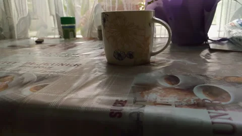 The cup is on the table in the kitchen Stock Footage 137101340