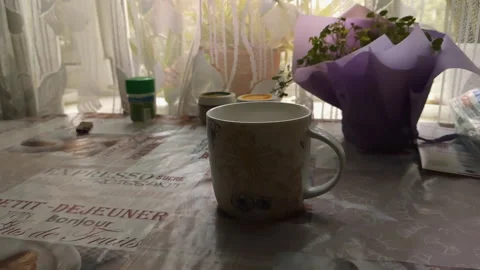 The cup is on the table in the kitchen Stock Footage 137101417