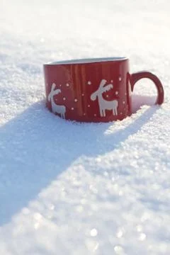 Cup is on the table in winter landscape Stock Photos