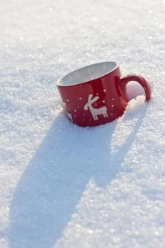 Cup is on the table in winter landscape Stock Photos