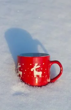 Cup is on the table in winter landscape Stock Photos