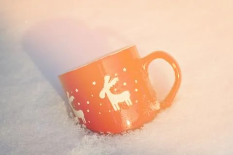 Cup is on the table in winter landscape Stock Photos