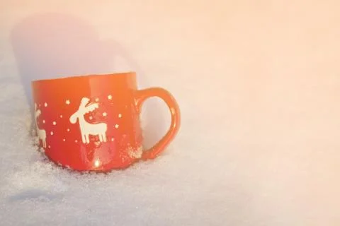 Cup is on the table in winter landscape Stock Photos