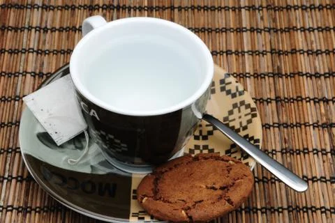 Cup of tea and a cookie Stock Photos