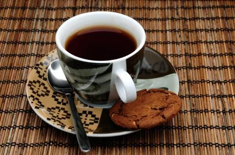 Cup of tea and a cookie Stock Photos