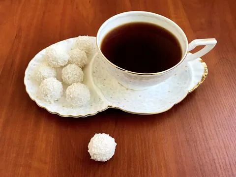 A cup with tea and dessert. Stock Photos