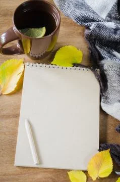 A cup of tea and empty notebook for sketch. Stock Photos