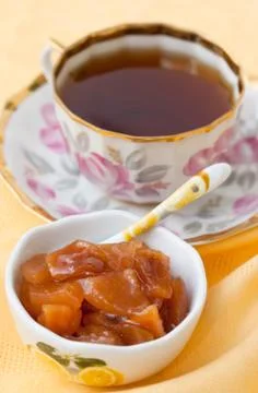 A cup of tea and jam Stock Photos
