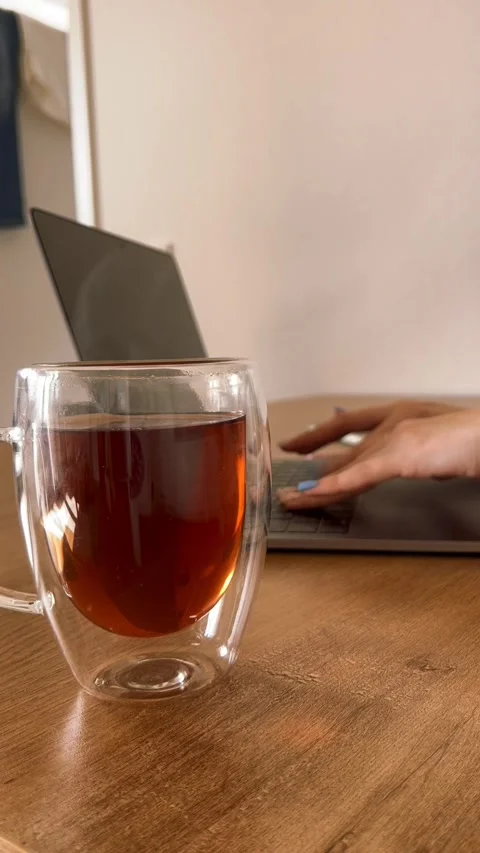 Cup of tea and laptop Stock Footage 332808506