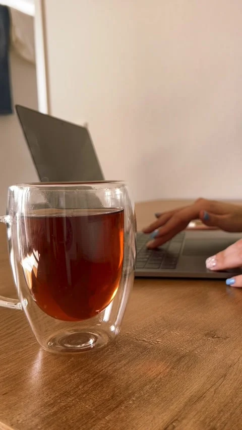 Cup of tea and laptop Stock Footage 332808508