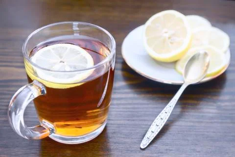 A Cup of tea and lemon on the table. Stock Photos
