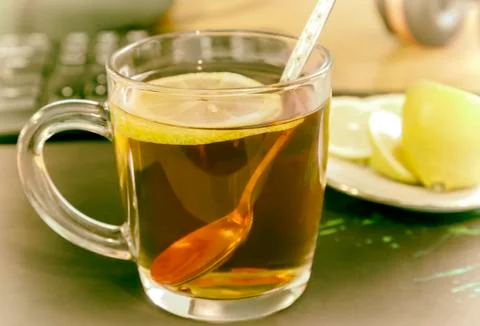 A Cup of tea and lemon on the table. Stock Photos