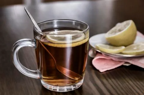A Cup of tea and lemon on the table. Stock Photos