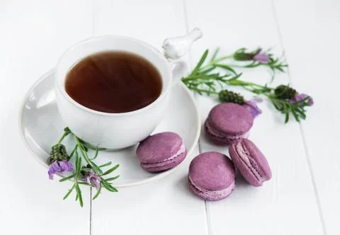 Cup of tea and macarons Stock Photos
