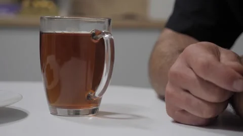 A cup of tea and a man's hand. Video stock 254241893