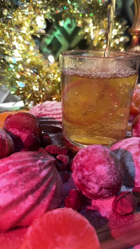 A cup of tea and nuts with condensed milk in a New Year's interior. Stock Footage 256221011