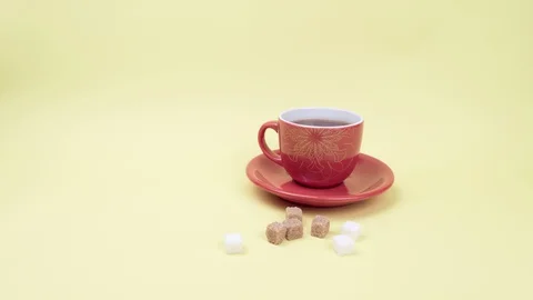 Cup of tea and slices of white and brown sugar. 스톡 동영상 129076003
