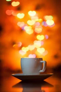 Cup of tea in the background bokeh in the form of hearts Stock Photos