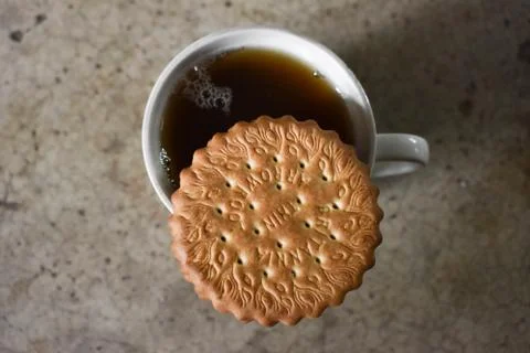 A cup of tea with biscuit . Stock Photos