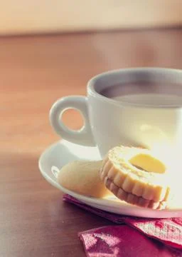 Cup of tea with biscuits Stock Photos