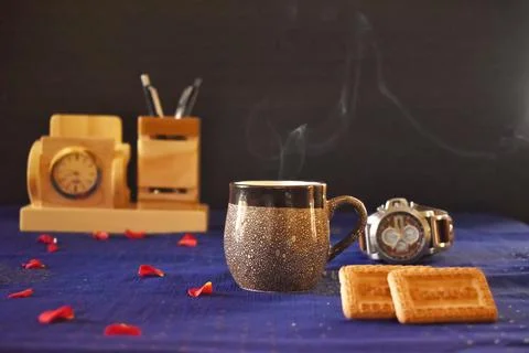 A cup of tea  with biscuits Stock Photos