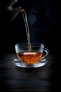 Cup of tea on black background Stock Photos