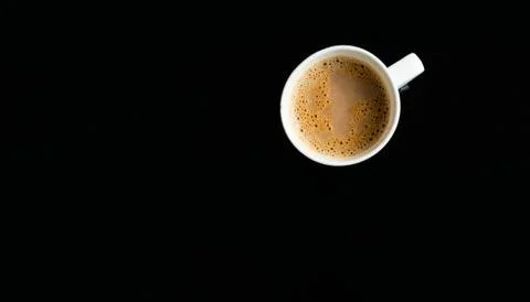 A cup of tea on a black background Stock Photos