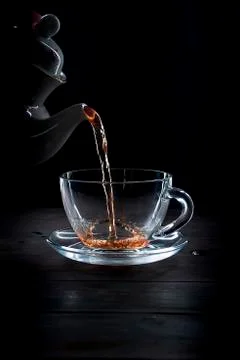 Cup of tea on black background 库存照片