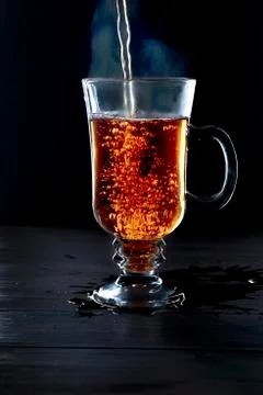 Cup of tea on black background Stock Photos