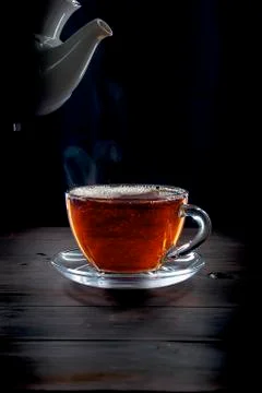 Cup of tea on black background Stock Photos
