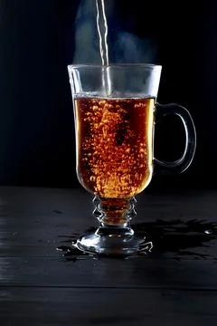 Cup of tea on black background Stock Photos