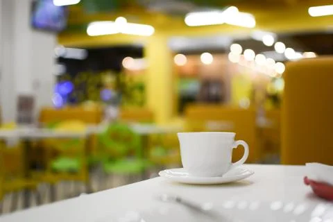 Cup of tea with blurred cafe as background Stock Photos