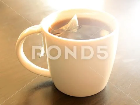 Cup of tea with burst light Stock Photos