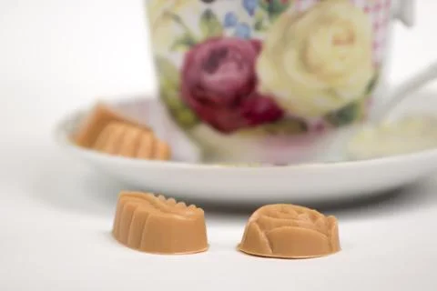 Cup of tea with candies Stock Photos