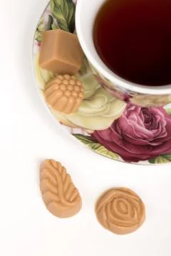 Cup of tea with candies Stock Photos