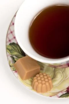 Cup of tea with candies Stock Photos