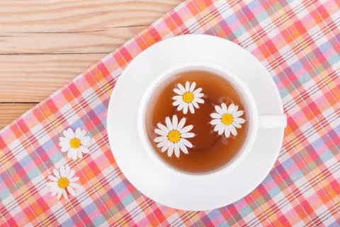 Cup of tea with chamomile. Stock Photos